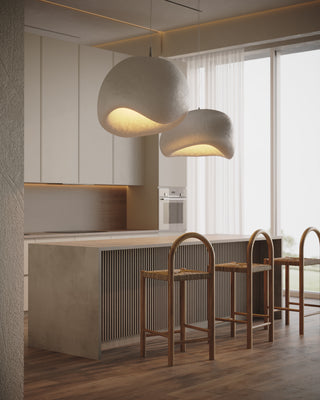 Designer bar stools in front of a contemporary island kitchen bench.