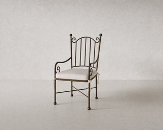 Aveline Chair, powder-coated iron with linen seat cushion, lifestyle
